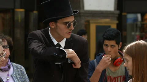 Young man doing a magic trick in Munich Stock Footage 54192984