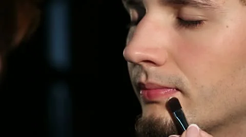 Young man doing make-up closeup Stock Footage 11013248