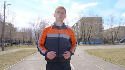 Young man doing morning jogging Stock Footage 128698760
