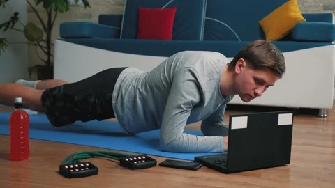 Young man doing plank exercise at home, sport and healthy lifestyle concept. Stock Footage 144490392