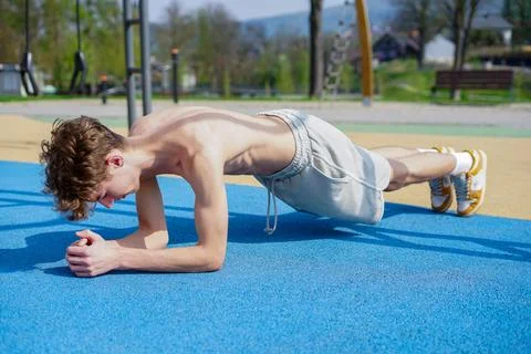 Young Man Doing Plank Exercise Outdoors Stock Photos