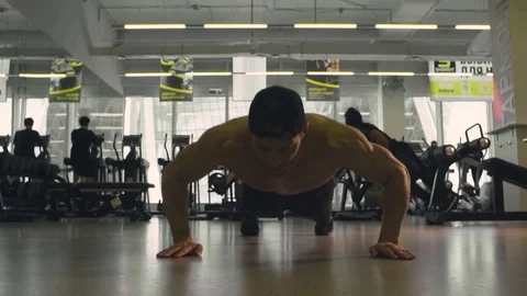 Young man doing push ups Stock Footage