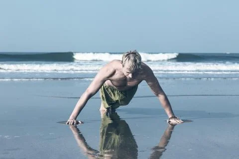 Young man doing push ups Stock Photos