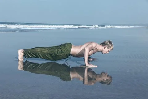 Young man doing push ups Stock Photos