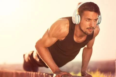 Young man doing push-ups. Stock Photos