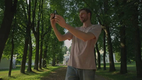 The young man is doing selfie.Red Helium 8K Stock Footage 156327658
