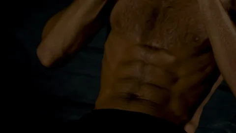 Young man doing sit-ups Stock Footage 85861964