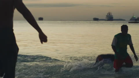 Young man doing somersault On The Beach  Tanzania  Africa Stock-Footage 131112364
