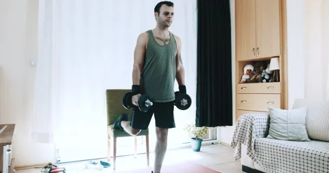 Young Man Doing Squats, Sport Training For Healty At Home Video stock 143999733