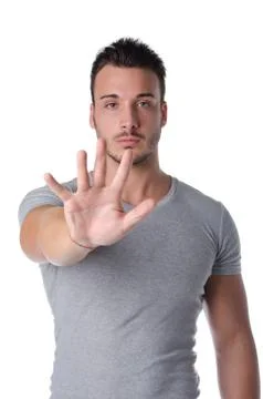 Young man doing stop gesture with his hand Stock Photos