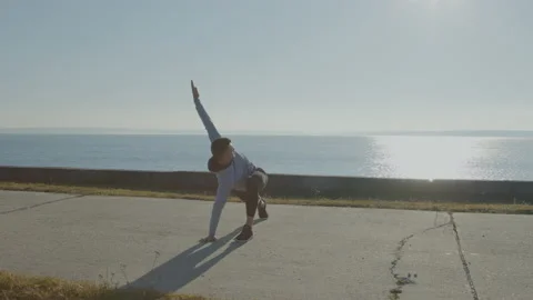 Young Man Is Doing Stretching Exercise In Park Stock Footage 165823274