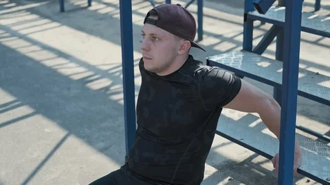 Young man doing triceps exercises using stairs outdoors. Active lifestyle 스톡 동영상 115029059