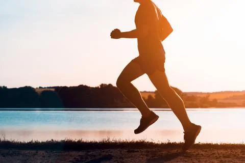Young man doing workout, exercising and running. Stock Photos