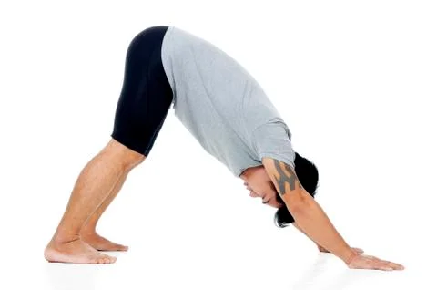 Young man doing yoga exercise Stock Photos