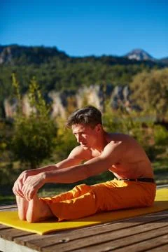Young man doing yoga Stock Photos