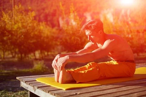 Young man doing yoga Stock Photos