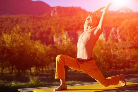 Young man doing yoga Stock Photos