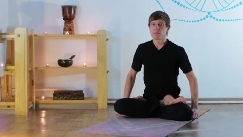 Young Man Doing Yoga in a Special Room Stock Footage 71811345