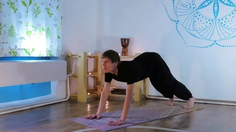 Young Man Doing Yoga in a Special Room Stock Footage 71812694
