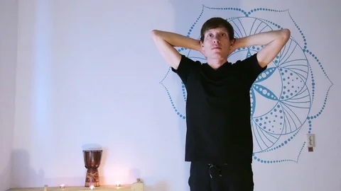 Young Man Doing Yoga in a Special Room Stock Footage 71813393