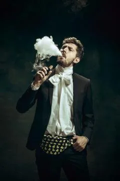 Young man as Dorian Gray on dark background. Retro style, comparison of eras Stock Photos