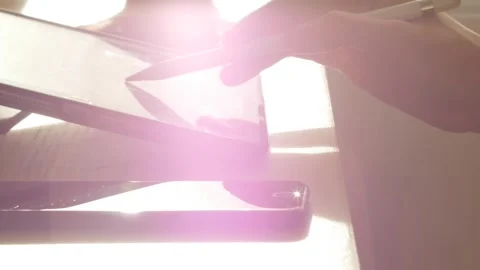 A young man draws with a pen on a tablet pc Stock Footage 220337320