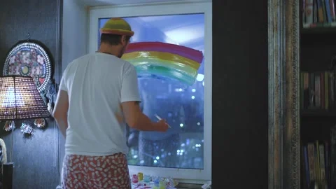 A young man draws a rainbow Stock Footage 143925528
