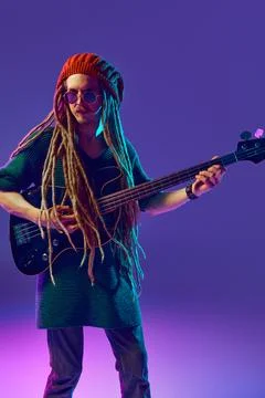 Young man with dreadlocks, beanie hat and sunglasses creating beautiful music Stock Photos