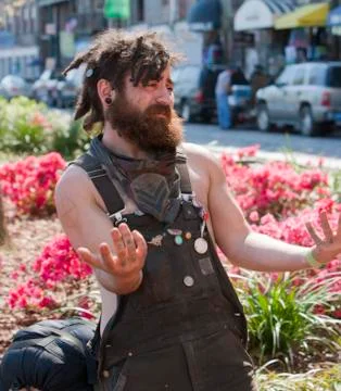 Young man with dreadlocks gesturing Stock Photos