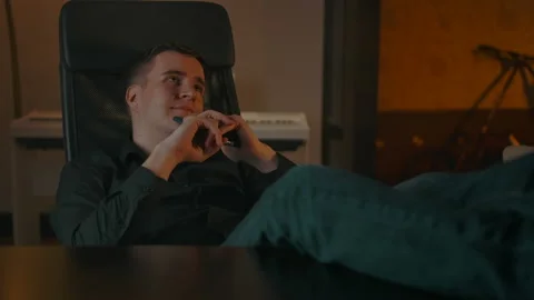 Young man dreaming about something, between remote job paused Stock Footage 143277759