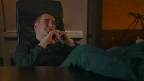 Young man dreaming about something, between remote job paused Stock Footage 162731461