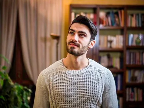 Young man with dreamy expression Stock Photos