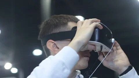Young Man Dresses Helmet of Virtual Reality Stock Footage 87136238