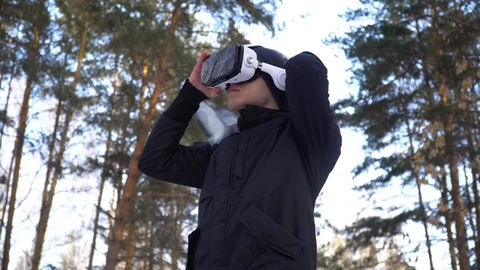 Young man dresses virtual reality glasses Stock Footage 85994229