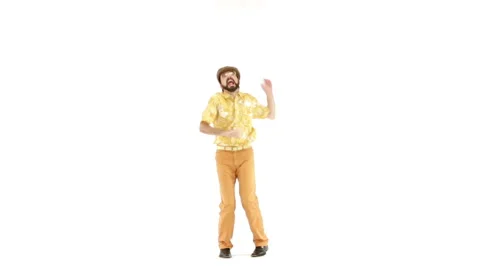 Young man dressing 70s yellow orange vintage clothes and hat dances 動画素材 64536940