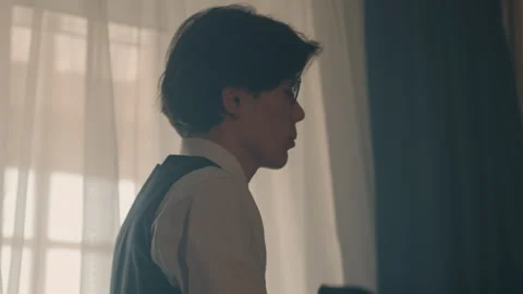 Young man dressing. Student prepares for day ahead. Casual morning routine in Stock Footage 337232130