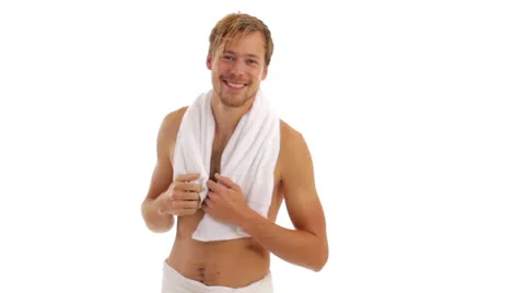 Young man dries himself with a towel Stock-Footage 24635074