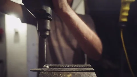 Young man drilling with power drill homemade concept Stock Footage 135612821