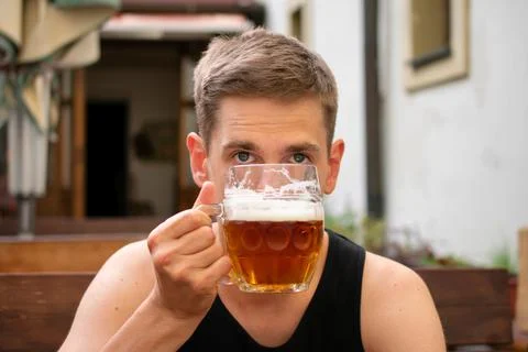 Young man drinking beer Stock Photos