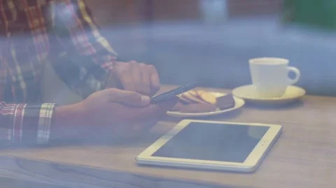 Young man drinking coffee in cafe looking out the window Stock Footage 68551271