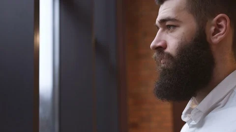 Young man drinking coffee in cafe Stock Footage 74007946