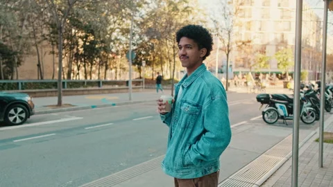 Young Man Drinking Coffee on City Street Stock Footage 319586119