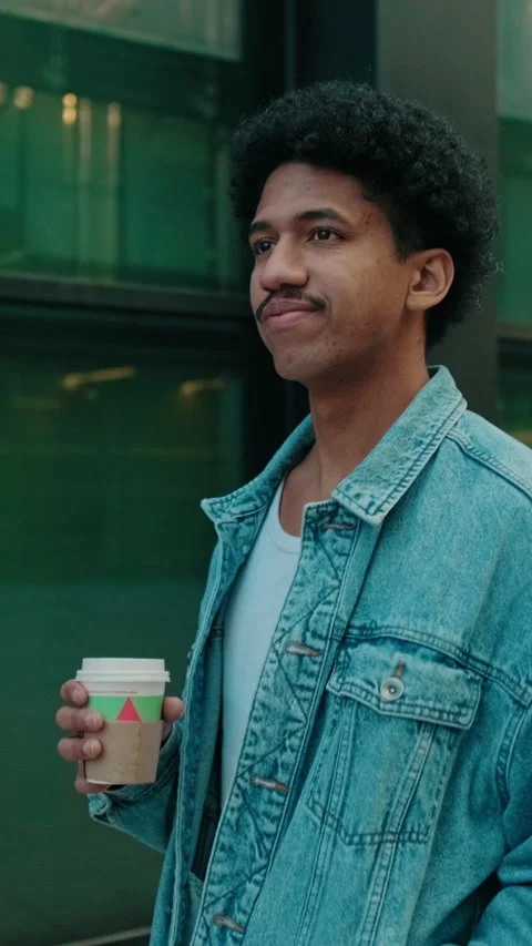 Young Man Drinking Coffee On City Street Stock Footage 320890129