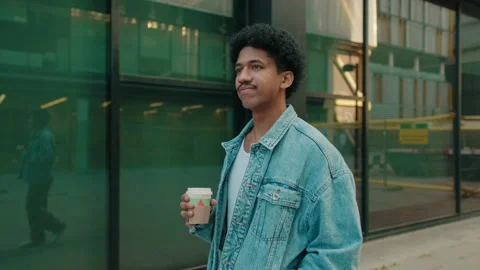 Young Man Drinking Coffee On City Street Stock Footage 322128101