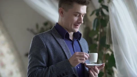 Young man drinking coffee Stock Footage 60951866