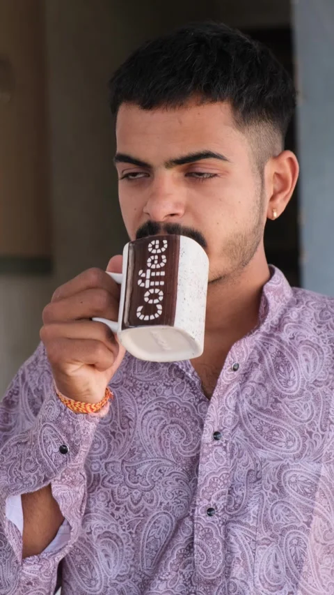 Young Man Drinking Coffee Outside Home – Casual Lifestyle Stock Footage 330738294