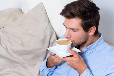 Young man drinking coffee Foto stock