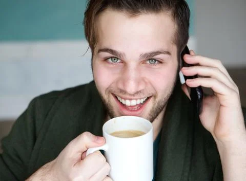 Young man drinking coffee Foto stock