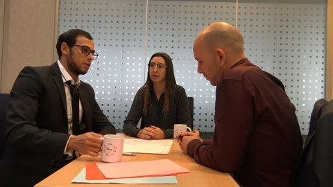Young Man Drinking Cup Of Tea During a Business Metting Stock Footage 121614685