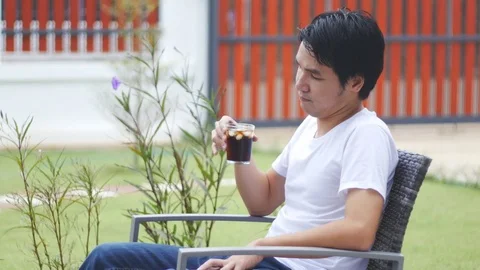 Young man drinking  Stock Footage 71758431